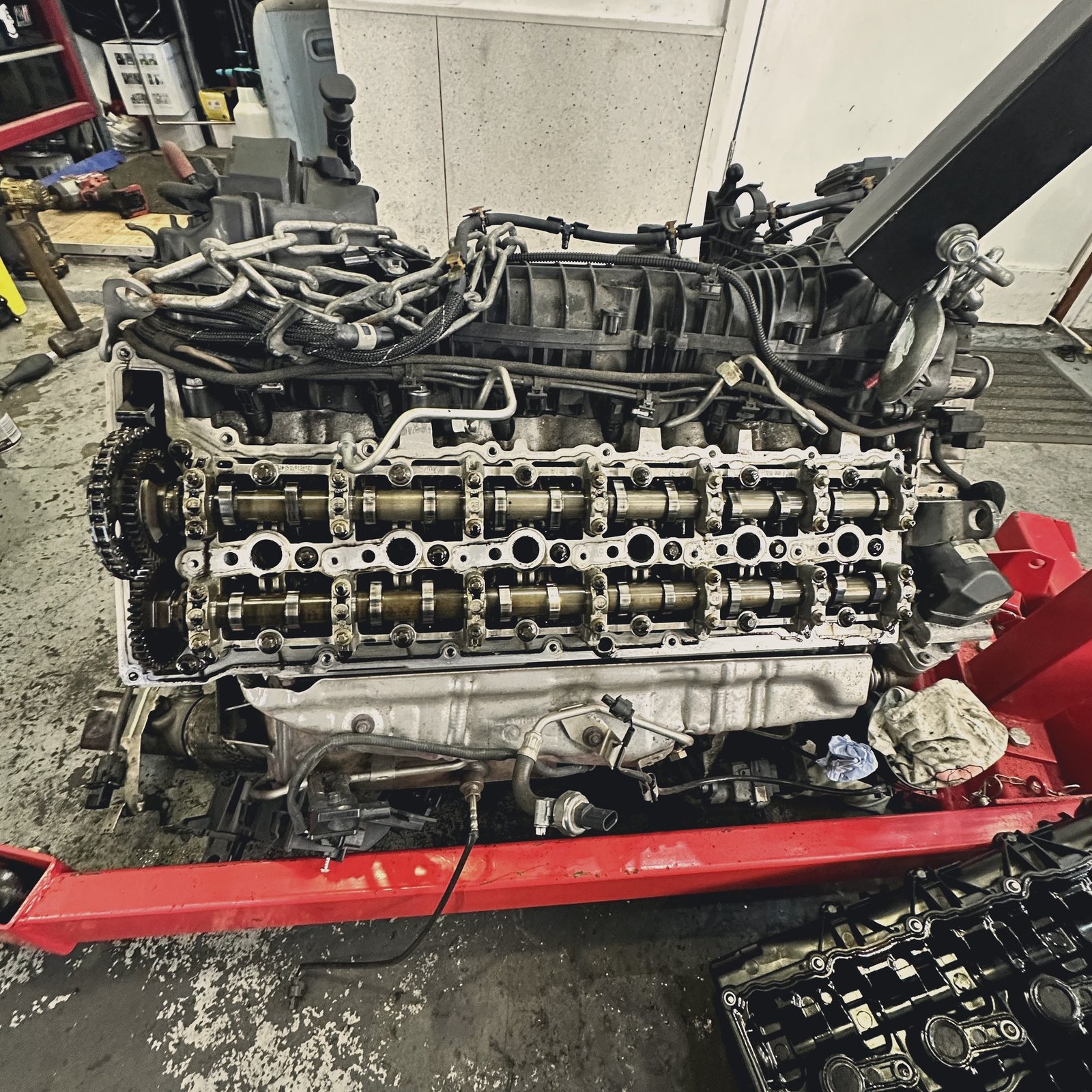Close-up of an engine cylinder head and camshafts during a rebuild